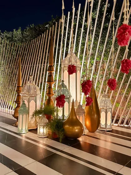 Another arrangement of lanterns and spires against our modern white slatted wall.