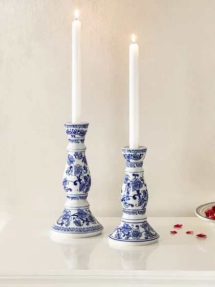 These blue pottery candle stands bring a touch of artistic flair to your ambiance. The traditional blue and white patterns on the ceramic base create a beautiful contrast with the warm candlelight, perfect for a serene evening.
