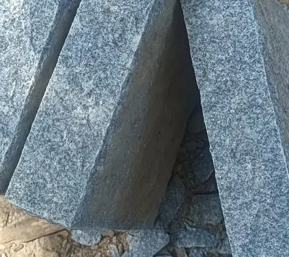 A stack of freshly cut, rectangular stone pillars.