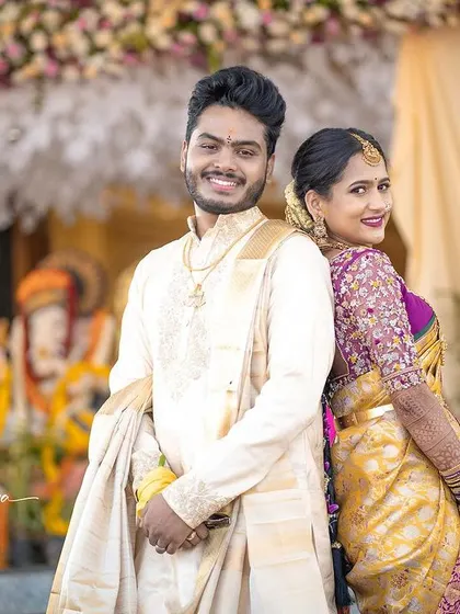 Another beautiful shot of the couple, showcasing their traditional wedding attire.