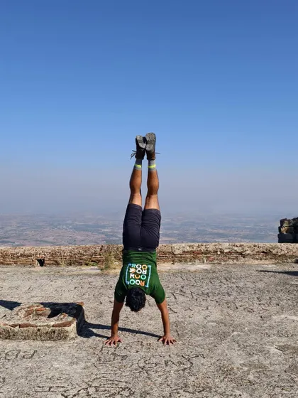 Finding my balance at 3,930 feet after trekking up Madhugiri Hill. Using my fitness to explore beautiful places is what it's all about.