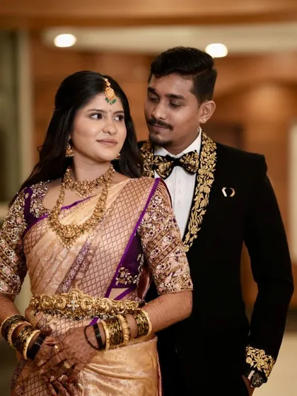 My stunning bride Deepika and her groom, who is wearing a custom-embroidered tuxedo jacket to match her saree.