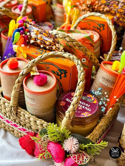A beautifully arranged Holi basket with traditional sweets and festive decorations.