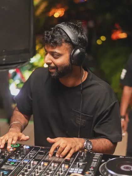 A happy, candid moment of me mixing. The smile is genuine; this is my happy place.