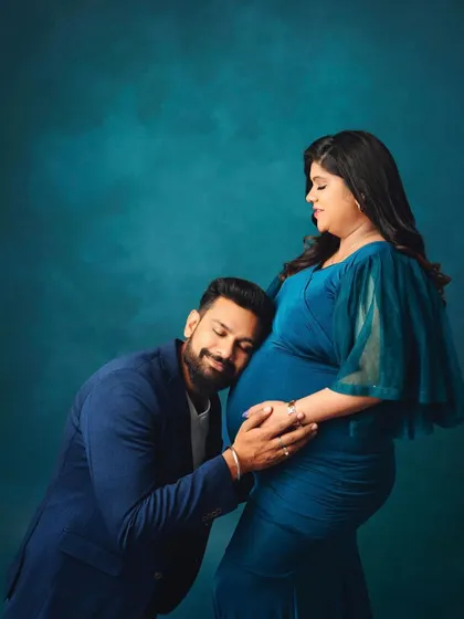 Listening for the first flutters. This is such a tender and classic pose that beautifully captures the bond between a father and his baby-to-be.