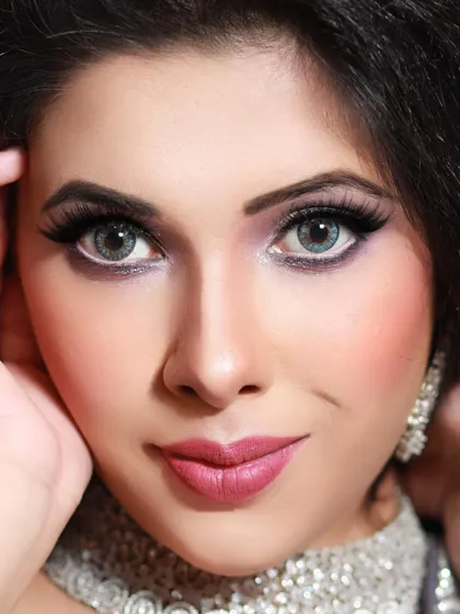 This extreme close-up demonstrates my technique for creating dramatic, eye-catching looks. The combination of purple eyeshadow, bold liner, and contact lenses creates a transformative and mesmerizing effect.