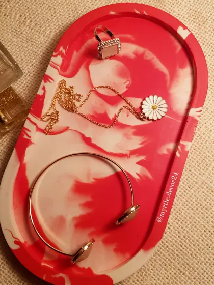 A bold red and white marble XL trinket tray, perfect for making a statement. It’s a great way to add a pop of color to your space.
