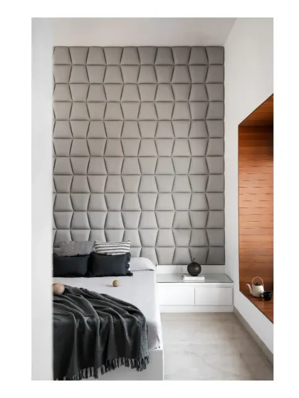 The master bedroom features a custom upholstered headboard with a geometric pattern, adding a layer of texture and softness to the minimal, Japandi-inspired space.