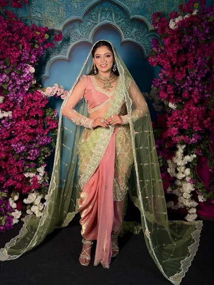 Adding a sheer veil to the 'Menka' Nauvari drape for a touch of modern bridal drama. This shows how you can layer traditional and contemporary elements.