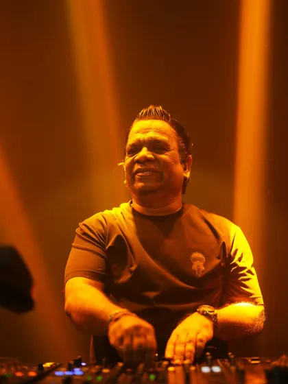 A close up shot of me on the decks, bathed in golden light. The focus is intense when I'm in the middle of a set.