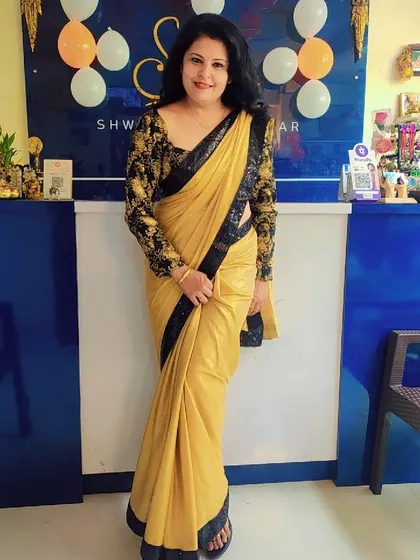 A full-length view of a birthday look I styled in my studio. The combination of a plain saree with a heavily worked designer blouse is one of my signature approaches to creating a balanced outfit.