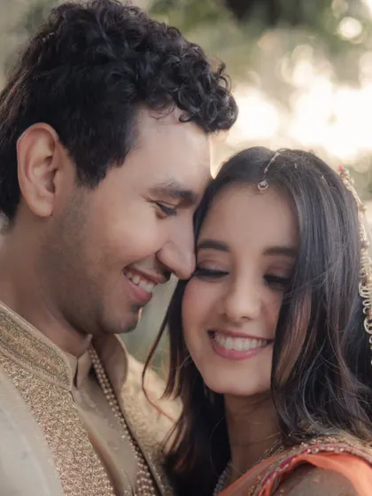 A close-up of the couple sharing an intimate moment, their joyful expressions and gentle touch telling a story of pure love.