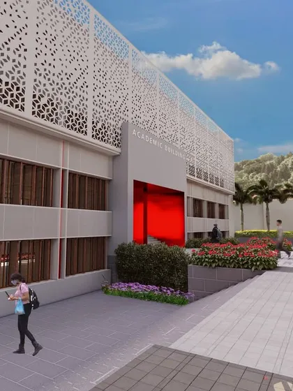 A rendering of the academic building at UNACCO School, featuring a modern facade with intricate screen patterns and a bold red entrance portal.