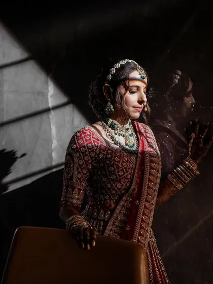 A dramatic portrait of the bride, Krina, using strong shadows to create a moody and artistic image.