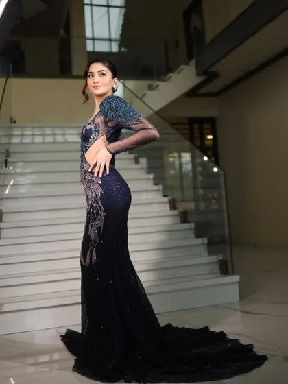 For the modern bride, this cocktail look is all about glamour. I styled this stunning, deep blue sequined gown with a soft glam makeup look and a chic updo, creating a statement for any evening event.