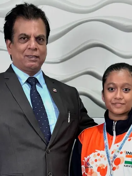 With a young female athlete from the KIO Indian Karate team after her medal-winning performance at the 11th Commonwealth Karate Championship in South Africa.