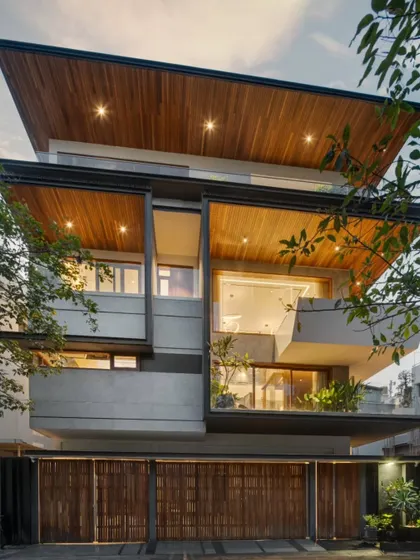 The finished Timber Edge residence. The transformation is defined by a new, layered facade featuring timber, projecting balconies, and refined detailing that completely alters its street presence.