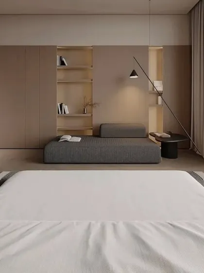 The other side of the room, showing the built-in shelving and a comfortable daybed for reading or relaxing.