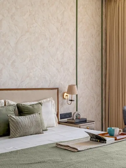 This angle highlights the seating nook I created in the master bedroom, featuring a custom-made armchair. It’s a perfect spot for relaxing, placed to take advantage of the natural light from the large window.