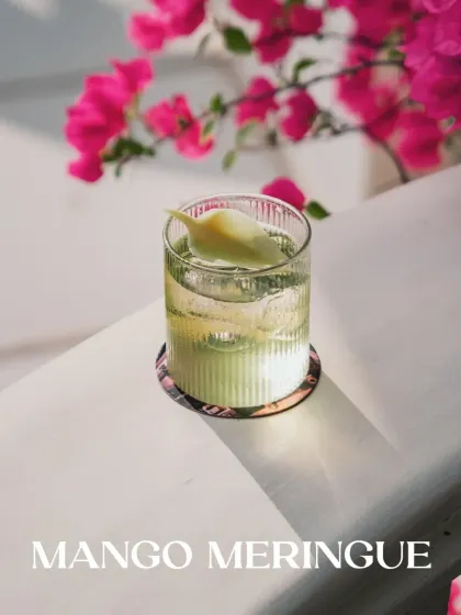The Mango Meringue is a golden secret from my mansion of curiosities. This non-alcoholic drink is a tropical dream, combining mango, lime, and white chocolate into a luxurious sip.
