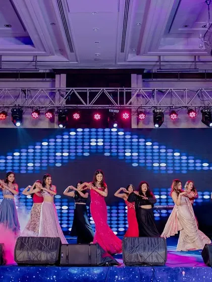 A dynamic shot of the bridesmaids' performance, complete with smoke effects and a stunning LED backdrop. We make sure your squad looks like they're in a music video.