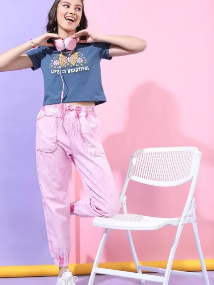 This "Life is Beautiful" look I styled combines a cropped graphic tee with pink joggers and headphones for a fun, music-inspired vibe.