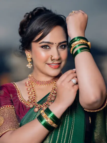 A beautiful portrait of a Marathi bride. I focused on creating a 'skin-like' makeup finish that looks natural and feels lightweight, letting her own beauty shine.