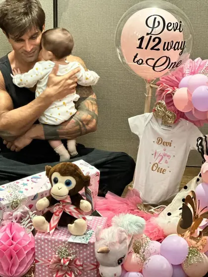 It made my day to see this picture of Karan Singh Grover with baby Devi and the hamper I created for her 'halfway to one' celebration. It’s an honor to be part of such special family moments.