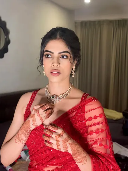 This is my philosophy: natural makeup helps you look like yourself. This simple, elegant look with a red saree is a testament to that.