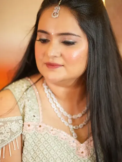For her engagement, Gayathri opted for a minimalist look with a pastel lehenga and soft, dewy makeup.