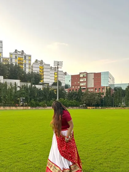 A beautiful white and red ghagra, perfect for a daytime Navratri event or a photoshoot.