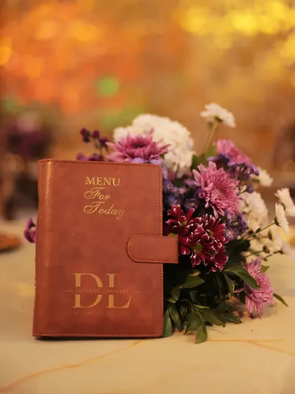 A close-up of our elegant menu holder. The gold foil "Menu For Today" and our "DL" brand logo communicate a sense of occasion and luxury.