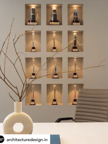We designed this grid of individually lit niches to serve as an elegant and impactful display for the client's awards, turning them into an integral part of the office decor.