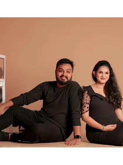 A classic seated portrait of the couple, showcasing their connection during this special time.