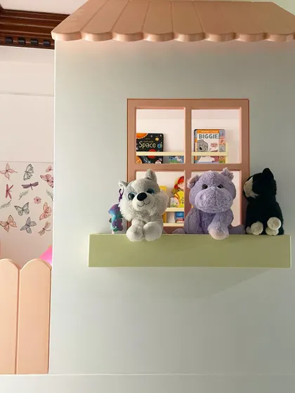 A peek-a-boo view through the window of the top bunk. I love adding these little details that spark a child's imagination and make their furniture feel like a real playhouse.