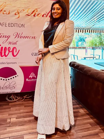Standing by the banner of an event celebrating women. It's a powerful reminder to keep pushing, keep winning, and keep supporting each other.