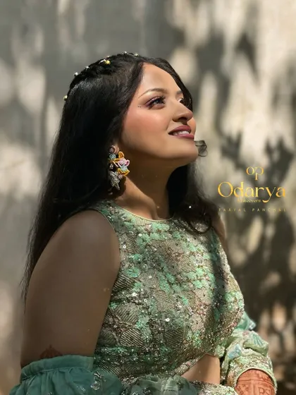 Looking up at the sun, the bride's makeup glows beautifully. I use high-quality products to ensure the makeup looks great in all lighting conditions.