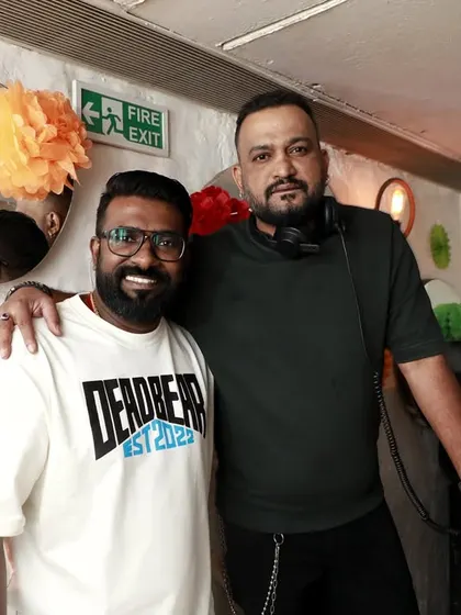 Posing for a photo with a friend during O' Bar Night. It's not just about the music, it's about the community and the people who come together to share the vibe.