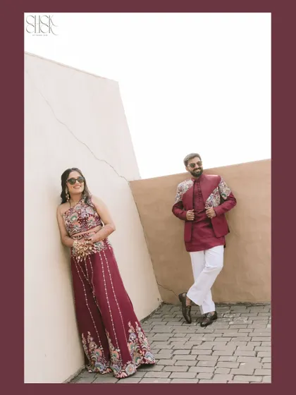 A fun, stylish portrait of the couple. Her relaxed lean and his confident pose perfectly capture their cool, modern vibe at this carnival event.