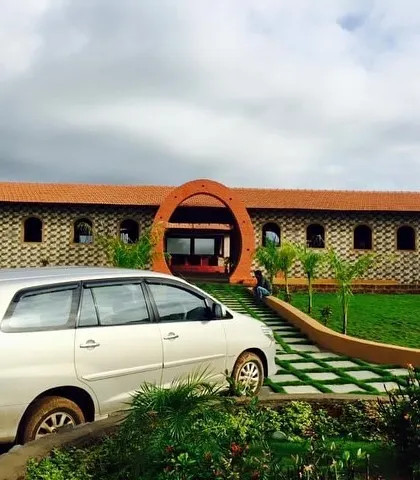 A complete tour of the stud farm project. The images showcase the unique architecture of the stables, the expansive green lawns, and the checkerboard pathways, all designed to be in harmony with nature.