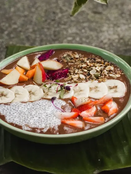 A smoothie bowl is my favorite way to start the day. This one is full of flavor and texture, with a rich smoothie base topped with fresh fruits, chia seeds, and our homemade granola. It's nature's broom, cleansing and energizing you.