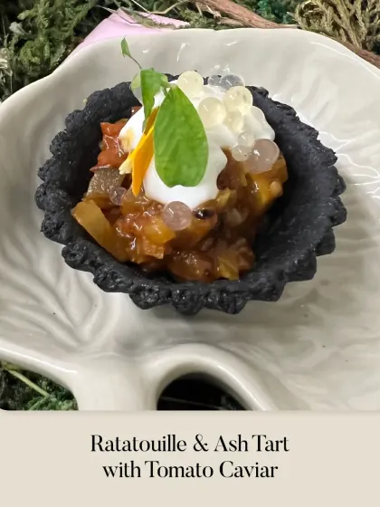 A savory Ratatouille & Ash Tart, topped with creamy foam and exquisite tomato caviar. A sophisticated, multi-textured bite.