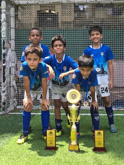 Our U-9 champions posing with their trophies after a fantastic tournament performance.