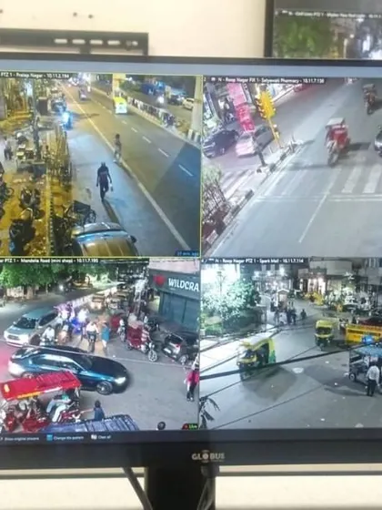 A four-camera split-screen view monitoring a busy city intersection at night. My installations for public spaces are designed to capture clear details of vehicles and pedestrian movement.