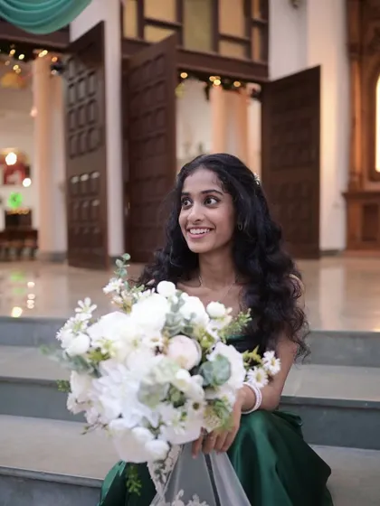 A beautiful bridesmaid with her bouquet. I kept her makeup natural and fresh to let her own beauty and her gorgeous curly hair shine.