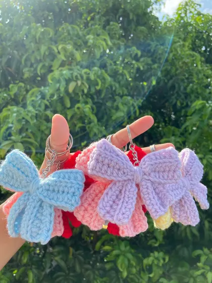 A collection of my crochet bow keychains in various colors. These are a simple yet elegant accessory, perfect for a wide range of customers.
