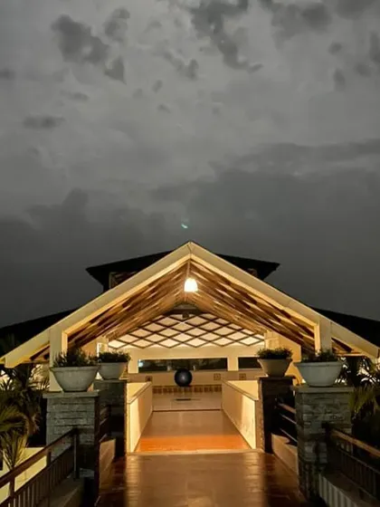 The entrance to our main hall, illuminated against the twilight sky. This welcoming light serves as a beacon of the warmth and care you will receive from the moment you arrive.
