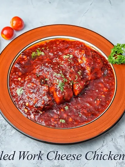 This dish combines the best of both worlds: grilled chicken and melted cheese. The chicken is cooked in a wok with a rich, savory sauce and topped with cheese for a gooey, delicious finish.