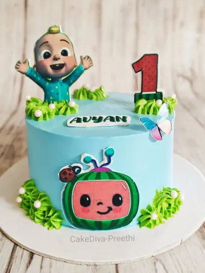 A simple and sweet Cocomelon cake for a first birthday. This design uses printed edible toppers on a smooth buttercream base, which is a great way to incorporate a theme cleanly.