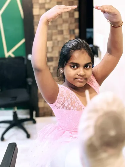 A young ballerina using a treadmill for advanced stretching exercises. I incorporate creative methods and equipment to help students safely improve their flexibility.